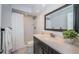 Bright bathroom with textured shower, modern vanity, and large mirror at 1402 Oleander Dr, Tarpon Springs, FL 34689