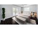 Inviting bedroom with private patio, wood-look floors, and neutral decor, providing a cozy retreat at 1402 Oleander Dr, Tarpon Springs, FL 34689