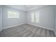 Well-lit bedroom featuring neutral walls, plush carpeting, and a ceiling fan at 1402 Oleander Dr, Tarpon Springs, FL 34689