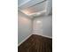 Entryway featuring wood-look floors, neutral walls, and a decorative front door at 1402 Oleander Dr, Tarpon Springs, FL 34689