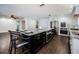 Bright kitchen with large island, stainless steel appliances, and modern finishes at 1402 Oleander Dr, Tarpon Springs, FL 34689