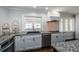 Bright, renovated kitchen featuring stainless steel appliances and granite countertops at 1402 Oleander Dr, Tarpon Springs, FL 34689
