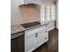 Kitchen featuring granite countertops, modern cabinetry, and stainless steel appliances at 1402 Oleander Dr, Tarpon Springs, FL 34689