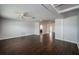 Open-concept living room with hardwood floors and a ceiling fan at 1402 Oleander Dr, Tarpon Springs, FL 34689
