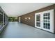 Spacious screened patio with doors leading to an outdoor pool area at 1402 Oleander Dr, Tarpon Springs, FL 34689