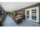 Relaxing screened patio with stylish furniture and a view of the inviting pool at 1402 Oleander Dr, Tarpon Springs, FL 34689
