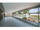 Large screened patio with a view of the pool and well-maintained backyard at 1402 Oleander Dr, Tarpon Springs, FL 34689