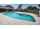 Aerial view of backyard swimming pool and patio at 1402 Oleander Dr, Tarpon Springs, FL 34689