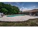 Inviting pool with patio, chairs, and landscaping, perfect for outdoor relaxation and entertaining at 1402 Oleander Dr, Tarpon Springs, FL 34689