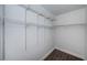 Ample walk-in closet with built-in shelving, providing practical and organized storage space at 1402 Oleander Dr, Tarpon Springs, FL 34689