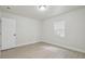 Minimalist bedroom boasts natural light from a window and fresh light-colored paint, perfect for relaxation and rest at 1404 E Curtis St, Tampa, FL 33603