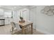 Bright dining area featuring modern furniture and a view into the adjacent, stylish kitchen at 1404 E Curtis St, Tampa, FL 33603