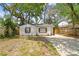 Charming single-story home featuring a well-maintained yard and a private driveway at 1404 E Curtis St, Tampa, FL 33603