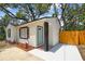 Inviting exterior view showcasing the entrance with a small landscaped area by the front door at 1404 E Curtis St, Tampa, FL 33603