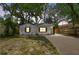 Charming home with new driveway, fresh paint, and attractive landscaping at 1404 E Curtis St, Tampa, FL 33603