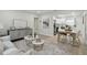 Open concept living room featuring stylish decor and a seamless flow to the modern kitchen at 1404 E Curtis St, Tampa, FL 33603