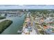 Elevated aerial shot displaying waterfront homes, private docks, and a picturesque canal scene with boats at 1421 Sea Gull S Dr, St Petersburg, FL 33707