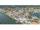 Expansive aerial view showcasing waterfront homes with docks and a scenic canal in a residential neighborhood at 1421 Sea Gull S Dr, St Petersburg, FL 33707