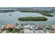 Aerial view of waterfront community with houses along the water, showcasing neighborhood's scenic views at 1421 Sea Gull S Dr, St Petersburg, FL 33707