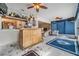 Entertaining bar area with mounted deer heads, liquor bottles, and connecting rooms at 1421 Sea Gull S Dr, St Petersburg, FL 33707