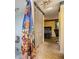 Hallway view of bathroom and bedroom with brightly-themed shower curtain, spacious closet and vintage ceiling fan at 1421 Sea Gull S Dr, St Petersburg, FL 33707