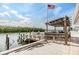 A covered boat dock featuring an American flag, boat lift and clear views of the adjacent waterways at 1421 Sea Gull S Dr, St Petersburg, FL 33707