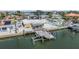 Waterfront property with private dock and boat lift, offering an ideal setting for boating enthusiasts at 1421 Sea Gull S Dr, St Petersburg, FL 33707