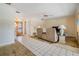 Living room featuring tile floors, a ceiling fan, and recliners with easy access to other rooms at 1421 Sea Gull S Dr, St Petersburg, FL 33707