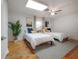 Guest bedroom featuring two twin beds, ceiling fan, and neutral color scheme at 14626 Wildwood Dr, Largo, FL 33774