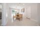 Dining area leading to the outdoor pool area through sliding glass doors at 14626 Wildwood Dr, Largo, FL 33774