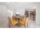 Dining room area featuring decoratively set round table and six chairs at 14626 Wildwood Dr, Largo, FL 33774