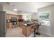 Modern kitchen featuring stainless steel appliances, breakfast bar, and lots of natural light at 14626 Wildwood Dr, Largo, FL 33774