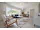 Bright and airy living room with large windows, modern furniture, and open layout at 14626 Wildwood Dr, Largo, FL 33774