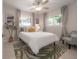 Serene bedroom with ample natural light, calming decor, and an area rug at 14626 Wildwood Dr, Largo, FL 33774
