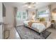 Cozy bedroom with a large bed, soft lighting, and neutral decor at 14626 Wildwood Dr, Largo, FL 33774