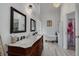 Bright bathroom featuring a clawfoot tub, double vanity, and modern fixtures at 1472 Bay View St, Tarpon Springs, FL 34689