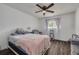 Bedroom with ceiling fan, chair, window, and comfortable bed at 1472 Bay View St, Tarpon Springs, FL 34689