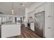 Bright kitchen featuring white cabinets, stainless steel appliances, and an open layout at 1472 Bay View St, Tarpon Springs, FL 34689
