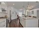 Stylish kitchen with white cabinets, granite countertops, and stainless steel appliances at 1472 Bay View St, Tarpon Springs, FL 34689