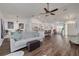 Spacious open-plan living room with vaulted ceilings, ceiling fan and luxury vinyl plank flooring at 1472 Bay View St, Tarpon Springs, FL 34689