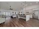 Open-concept living space featuring a modern kitchen, dining area, and comfortable seating at 1472 Bay View St, Tarpon Springs, FL 34689