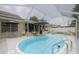 Inviting pool and screen enclosure providing a private outdoor oasis at 1472 Bay View St, Tarpon Springs, FL 34689