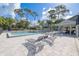 Relaxing community pool with lounge chairs, playground, and poolside shelter at 1472 Bay View St, Tarpon Springs, FL 34689