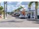 Quaint street lined with shops, palm trees, and parked cars, illustrating a vibrant commercial area at 1472 Bay View St, Tarpon Springs, FL 34689