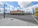 Classic brick building with awnings on a sunny corner, showcasing the area's vintage charm at 1472 Bay View St, Tarpon Springs, FL 34689