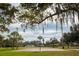 Outdoor basketball court with green surroundings and mature trees in a recreational park setting at 1500 Ohio Ne Ave, St Petersburg, FL 33703