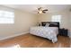 Cozy bedroom featuring a comfortable bed, wood flooring, and natural light, perfect for relaxation at 1500 Ohio Ne Ave, St Petersburg, FL 33703