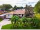 Features a well-kept lawn, beautiful palm trees, and a neatly paved driveway at 1500 Ohio Ne Ave, St Petersburg, FL 33703