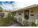 The house features neat landscaping, a white picket fence, and decorative outdoor lighting at 1500 Ohio Ne Ave, St Petersburg, FL 33703