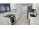 Modern kitchen with white marble countertops, stainless steel appliances, and stylish finishes at 1500 Ohio Ne Ave, St Petersburg, FL 33703